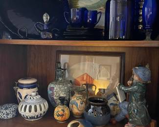 Vintage cobalt glass, and ceramics found on the bookcase in the Den