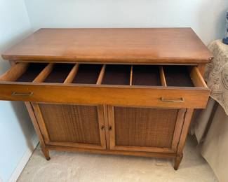 Server showing the storage drawer for flatware