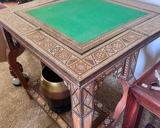 Opens up to a game table ~