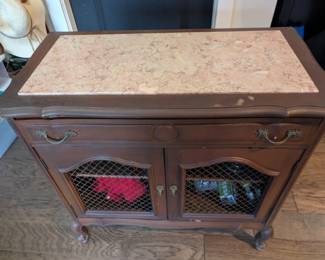 antique marble top cabinet with wire mess doors 