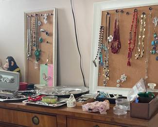 vintage doll and monkey, costume jewelry, silverplate trays, cork peg boards