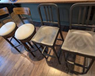 two sets of wood and metal barstools