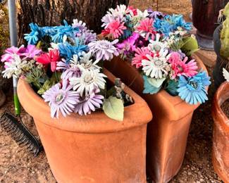 Faux flowers in large terracotta pots 