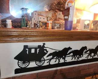The house is full of "old west" and American Indian motif items. A real cowboy's (or cowgirl's) dream. Everything from Artwork, Blankets, Leather medallion bolo ties to metal silhouettes. SOLD