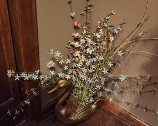 Flowers in set of gilded shoes