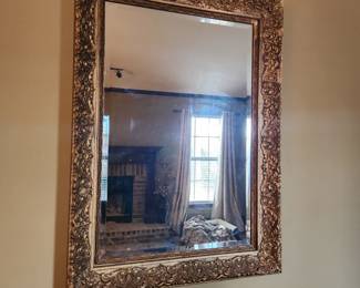 Framed gold color mirror
