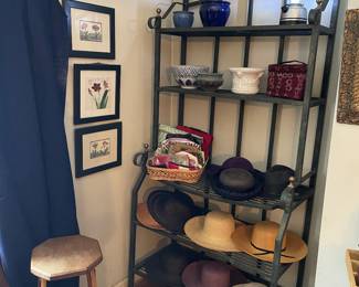 Metal Baker's rack, vintage wood step stool, women's hats, and pottery