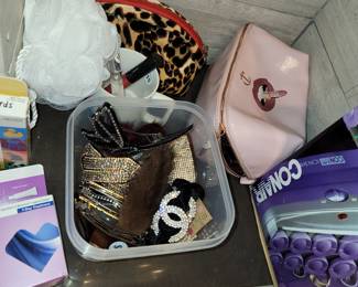 Cosmetics and personal care items. Make up bags and cases, electronics (hair dryers, curlers, etc), hair care barrettes, bands, etc
