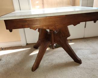 antique marble top coffee table, measures: 30" long x 20" wide x 20" tall.  $50.00