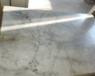 antique marble top coffee table, measures: 30" long x 20" wide x 20" tall.  $50.00