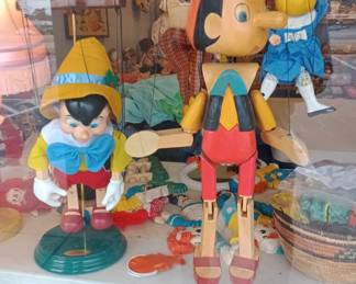 He's a Wooden boy!! Pinocchio marionette large and awesome!!and his little brother beside him 
