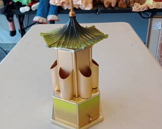 mechanical music box that opens up and turns not sure if it was for cigars, lipstick or what but its awesome 