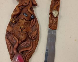 knife with crazy leather sheath and stones 