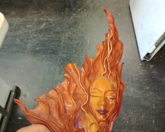faces crafted into dried leather 