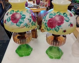 awesome pair of vintage oil lamps Aladdin burners with uranium glass bottoms and cadmium above. you don't find many pairs like this that haven't been electrified and messed up