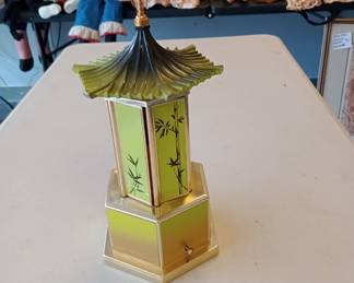mechanical music box that opens up and turns not sure if it was for cigars, lipstick or what but its awesome 