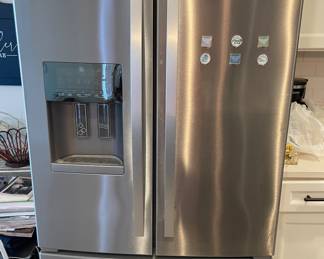 Whirlpool - needs a good cleaning - nice garage fridge. 