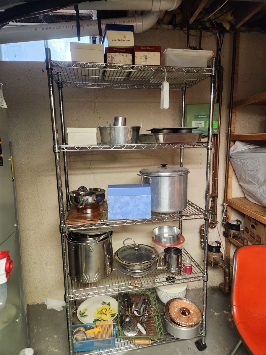 Lots of pots and pans on a sturdy wire rack which is also for sale