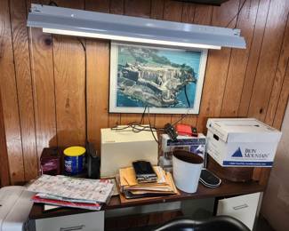 Shop light, and a metal desk, with various things we still have to unpack and make look really nice