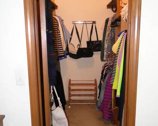 We have closets filled with clothing, both men's and women's, three closets in total filled with clothing