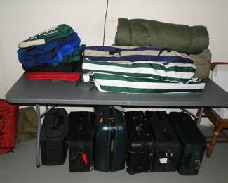 Luggage for travel, and folding chairs for sitting