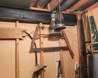Lanterns hanging from the ceiling, and saws on the wall