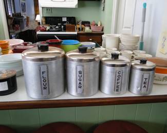 Flour, Sugar, Coffee, Tea.  Otherwise known as a canister set, from way back