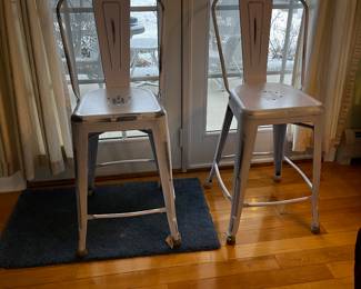 We have four of these distressed white metal stools