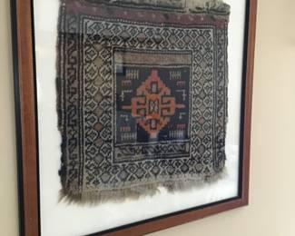Persian framed rug remnant.