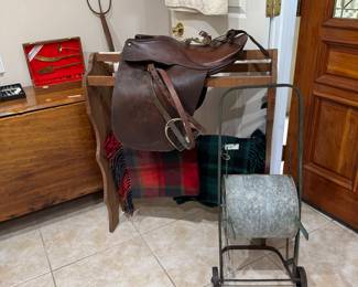 ENGLISH STYLE RIDING SADDLE, ANTIQUE GARDEN HOSE WHEEL, PENNINGTON TARTAN THROWS, QUILT RACK