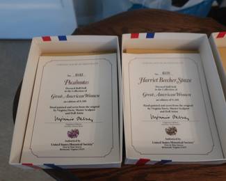 paperwork on  2  of  the women  figures