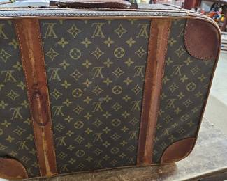 Louis Vuitton (zipper replaced by Vuitton)