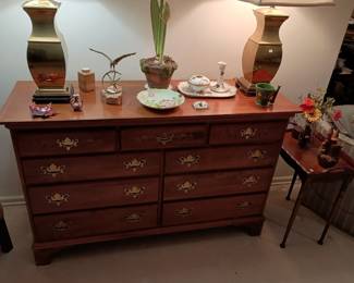 Double dresser (Hitchcock?) Pair of brass lamps. Curtis Jere eagle sculpture. Antique Limoges dresser set