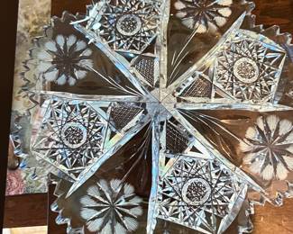 Lots more cut crystal serving dishes, vases and glass ware this photo is one example