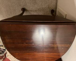 The vintage drop leaf table with a leaf dropped