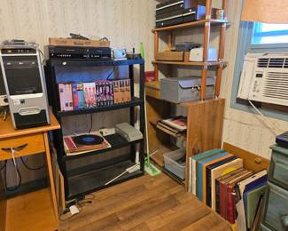 Attic room to the right is where you will find vinyl albums, a few vhs tapes, some audio cassettes and more office furniture. 