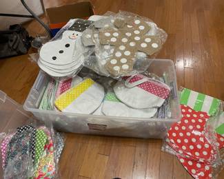 Container 3 of 3. This has a variety of 20 colored makeup bags, 16 Easter baskets/or carry bag, 10 crosses, 2Eggs, 3 Snowmen, 4 Stockings and two pink towel wraps. MAKE A REASONABLE OFFER on all Three containers. Not for individual sale.