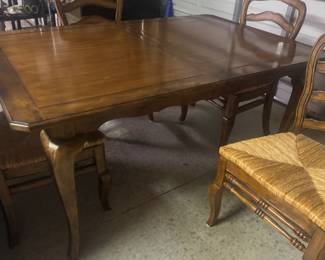 French country dining table with four rush, seat, chairs, solid wood