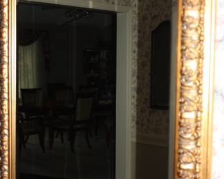 Beveled glass mirror in gold frame