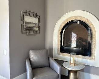 Modern swivel chair in gray leather, decor from Uttermost