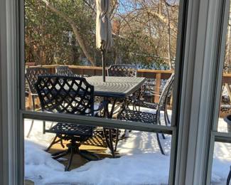 Another umbrella table with 4 chairs