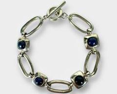 Lovely Sterling Silver Open Link Bracelet with Blue Stone & Toggle Clasp.
