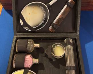 Women’s vanity case: mirror, brush,comb, perfume and makeup bottles.  $ 90.00
