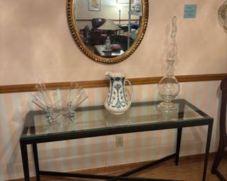 Glass top black metal base console table.  $200.00