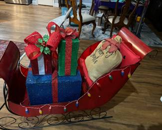 Metal sleigh and packages $150.00