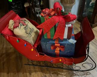 Metal sleigh and packages $150.00