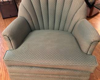 Green scalloped back arm chair. 31”w 22”d 31”t.                  $ 100.00