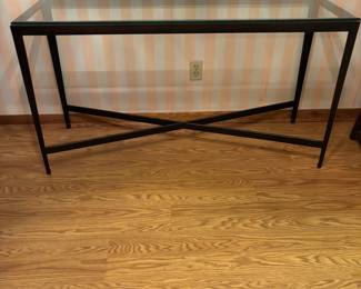 Glass top black metal base console table.  $200.00