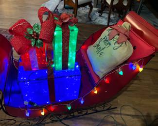 Metal sleigh and packages $150.00