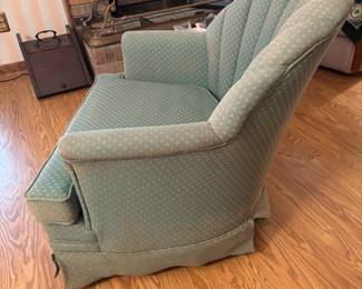 Green scalloped back arm chair. 31”w 22”d 31”t.                  $ 100.00